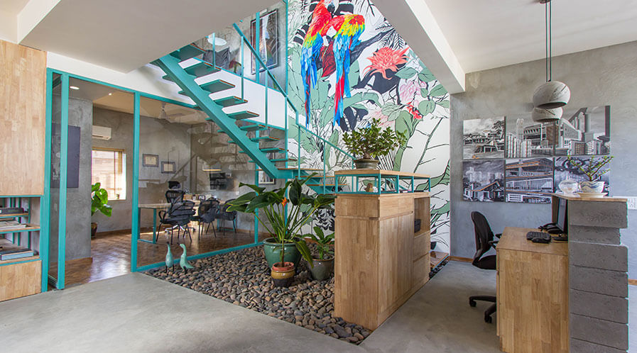 Courtyard with mural in architect office by NG Associates