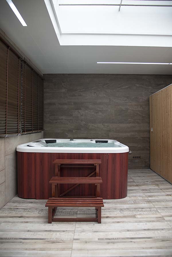 The sauna and spa are oriented along the southern side, while the salon, shower cubicle and WC are on the opposite side.  Photo Courtesy: Arun and Associates